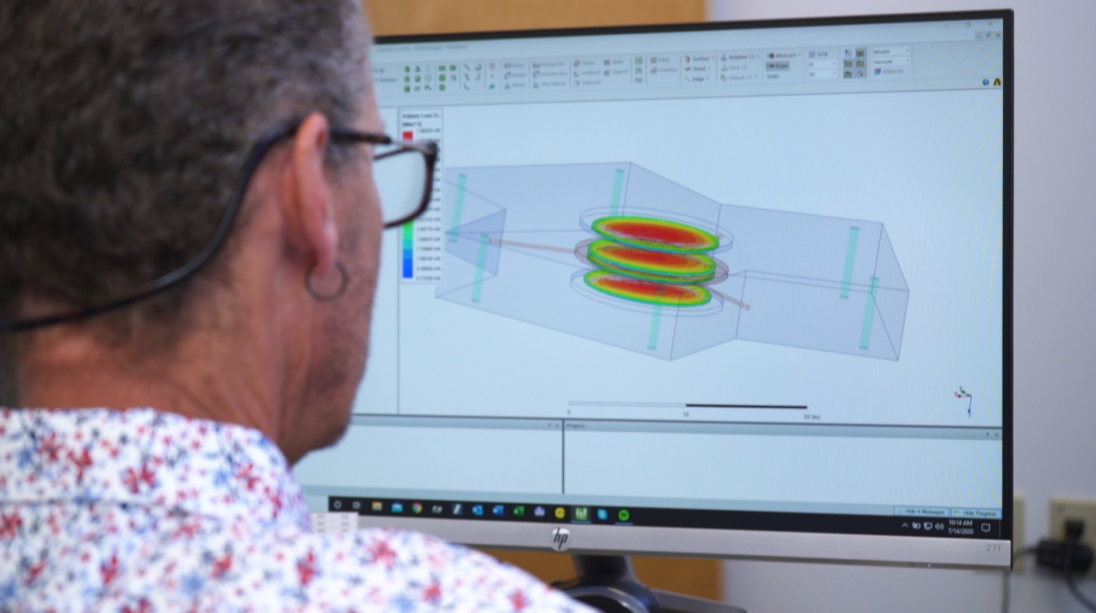 Computer screen displaying a simulation of electromagnetic fields inside a mechanical structure